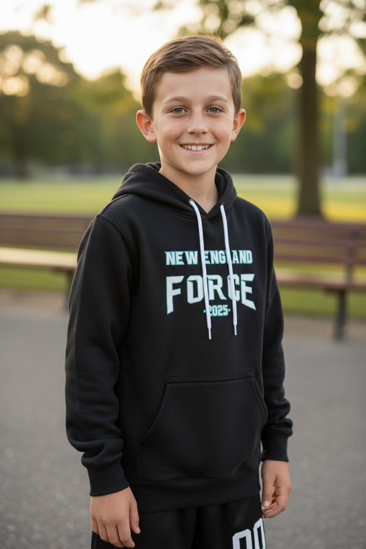 Youth player wearing a black New England Force team hoodie