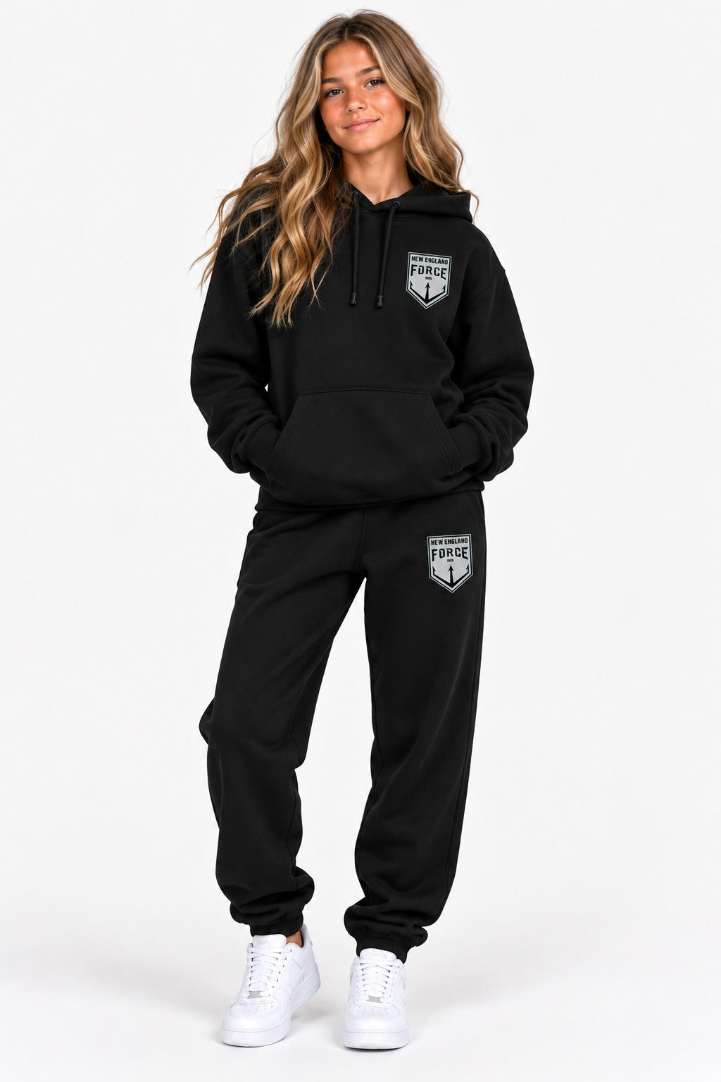 New England Force hoodie and sweatpants set in black with gray crest, worn by a girl