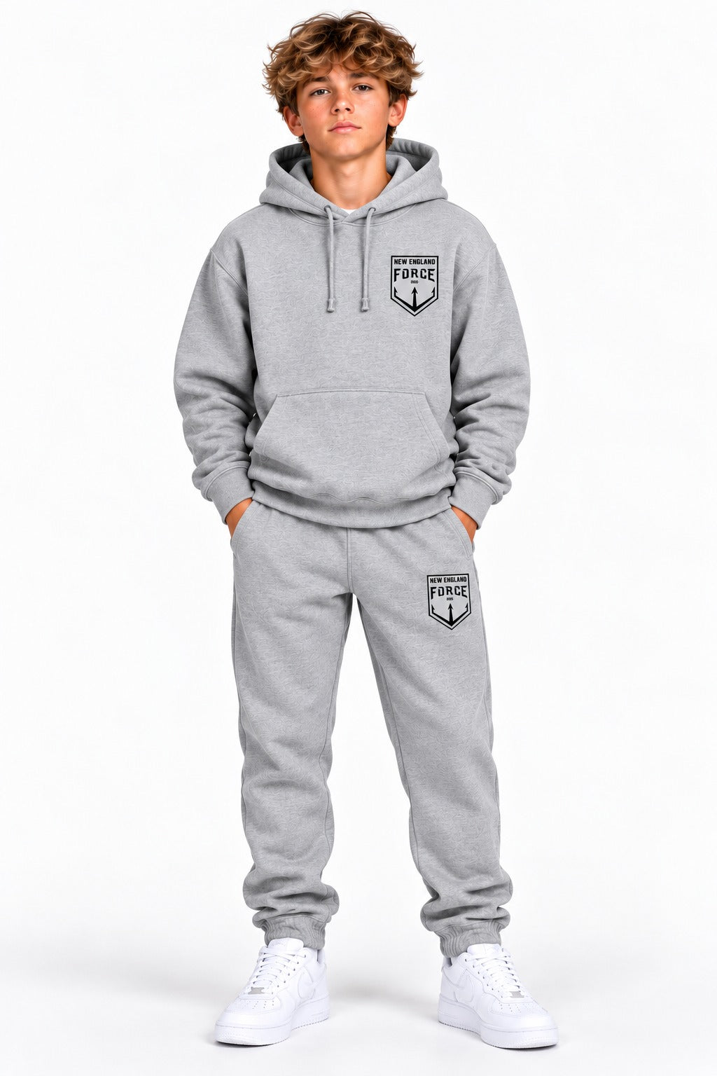 New England Force hoodie and sweatpants set in gray with black crest, worn by a boy